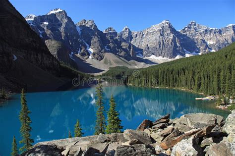 Scenic View Of Moraine Lake And Mountain Range At Sunset Stock Image