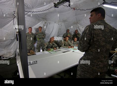 Soldiers Host An Air Mission Brief To Coordinate The Training Exercise