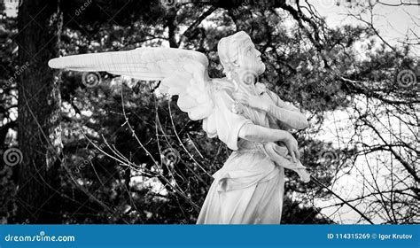 Sculpture Of An Angel Lamenting The Sins Of People Stock Image Image