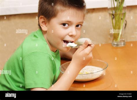 Boy Eating Porridge Stock Photo Alamy