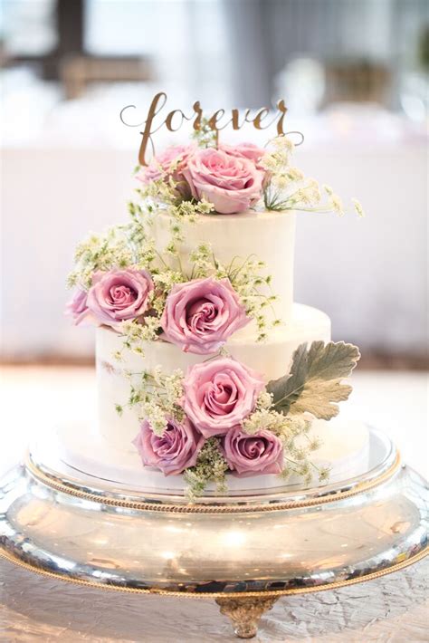 Check out the following cake decorations—from deckle edge, to drip, and everything in between—to inspire your own wedding cake. White Wedding Cake with Pink Roses