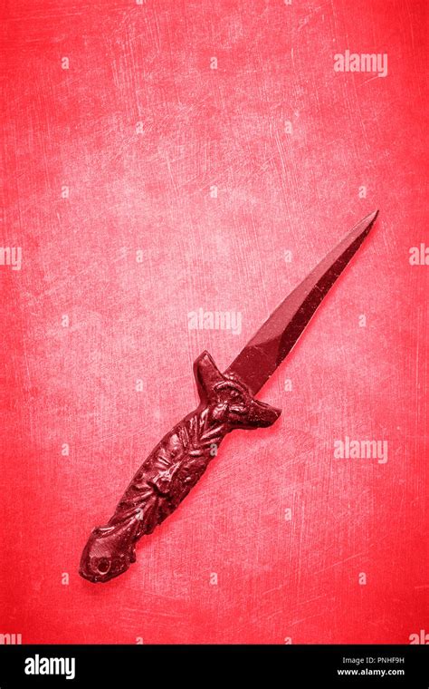 Red Wicca Wiccan Dagger On A Red Textured Background With Space For