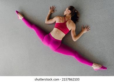 Beautiful Flexible Girl Doing Split Exercise Stock Photo