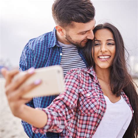 playful romantic couple taking selfies together by joshua resnick 500px