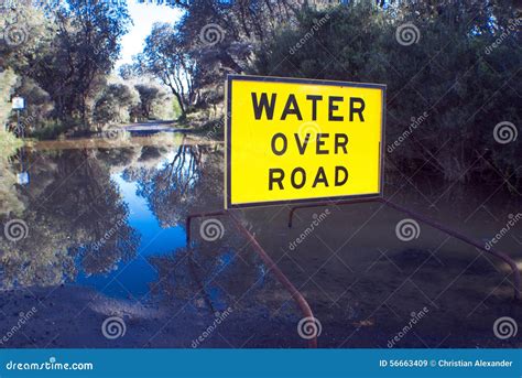 Water Over Road Sign Stock Image Image Of Rural Warning 56663409