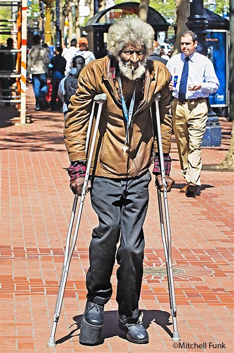 Man On Crutches In Tenderloin District San Francisco By Mitchell Funk