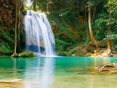 Nature Falls Pool With Turquoise Green Water Rock Coast