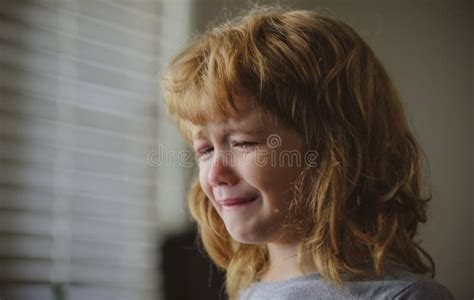 Close Up Face Of Crying Kid Boy Sad Child With Tears At Home Stock