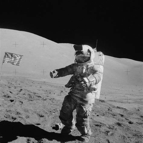 Apollo 17 Astronaut Harrison Schmitt Stands Beside The Flag In What Is
