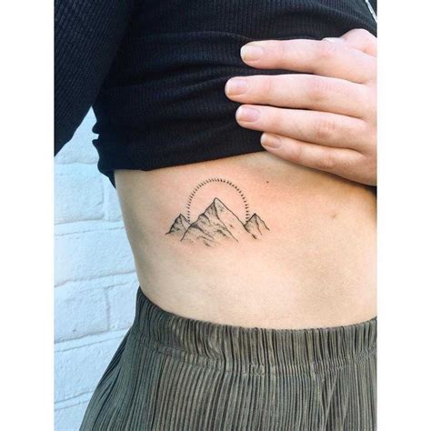 Discover the best side and rib designs for your next tattoo. Beautiful sun and mountains by Zaya tattooed on the right ...