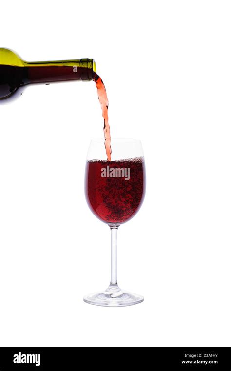 Red Wine Pouring Into Wine Glass Isolated On White Background Stock