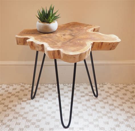 The natural wood on this chunky coffee table will definitely add character and class to any space. Rustic Wood Slice Coffee Table on Hairpin Legs - ZaZa Homes