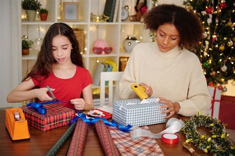 Premium Photo Teenage Girls Wrapping Presents For Christmas