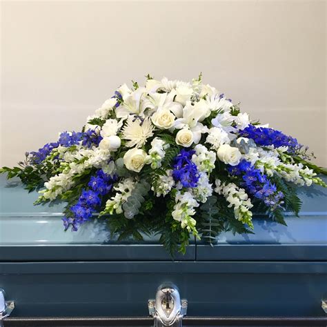 Check spelling or type a new query. White and Blue Casket Spray | Hollywood Forever