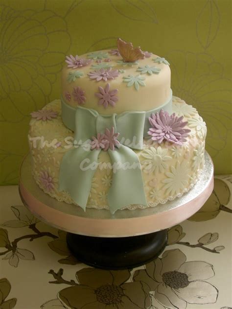 One of our most popular happy birthday bouquets is the cake arrangement. Two-Tier-Birthday-Cake-with-Pastel-Flowers-and-Butterfly ...