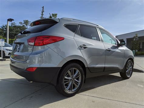 Tucson is a bit smaller than the. Pre-Owned 2014 Hyundai Tucson SE FWD Sport Utility