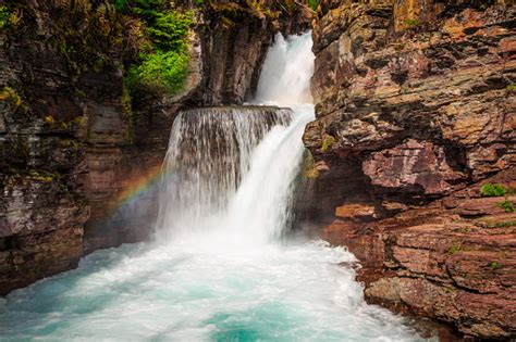 Rainbow On Saint Mary Falls Glacier National Park Stock Photo