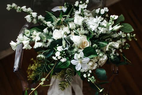 Loose And Organic Hand Tied Bridal Bouquet Of White Clematiswhite And Ivory Roses White