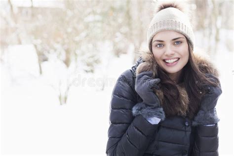 Portrait Of Beautiful Brunette Woman During Winter Stock Photo