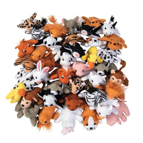 A Pile Of Stuffed Animals Sitting Next To Each Other