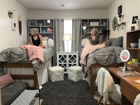 Two Women Sitting On Twin Beds In A Bedroom