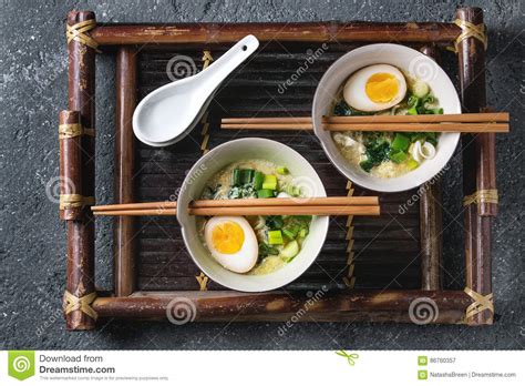 Once the spinach has wilted and the peas are warmed through, lightly beat and add in the eggs. Asian Soup With Eggs, Onion And Spinach Stock Image ...