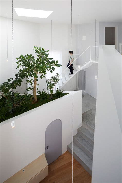 Japanese Residence By Airhouse Encloses Minimalist Interior Of Slanted