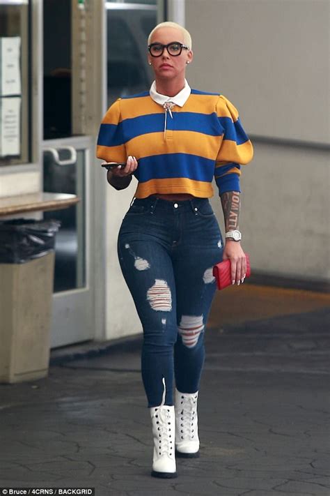 amber rose flaunts hourglass figure in skintight jeans daily mail online