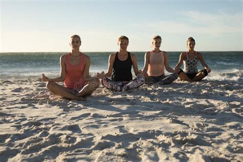 Women Doing Yoga On The Beach Stock Photo Image Of Hobby Exercise