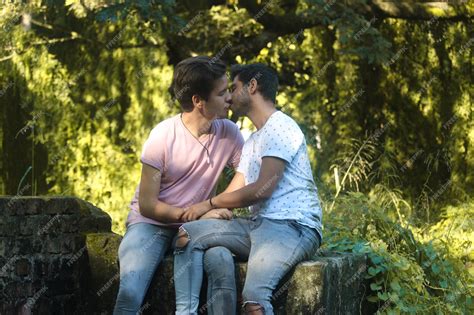 Premium Photo A Young Gay Male Couple Kissing In The Park