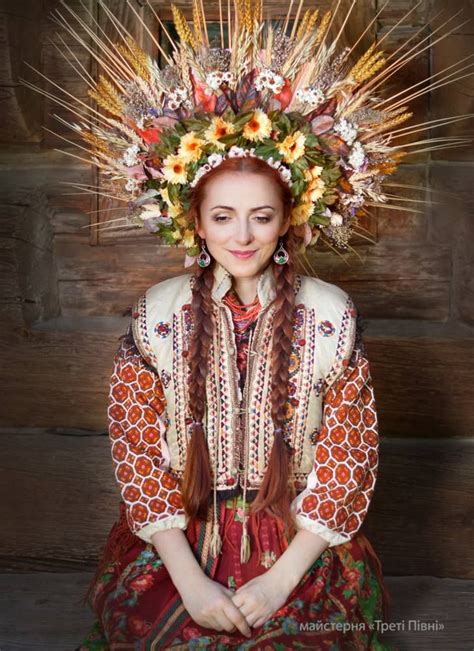 beautiful ukrainian woman with fabulous embroidered garment and headdress floral headdress