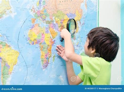 Little Boy Using Magnify Looking On Map Stock Image Image Of Vacation