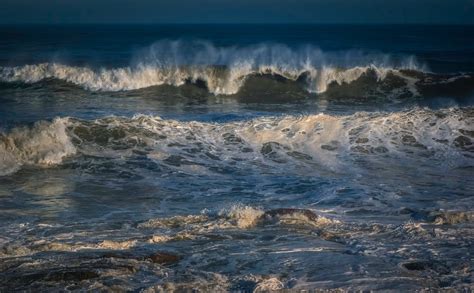Stormy Blue Sea Waving Near Coast · Free Stock Photo