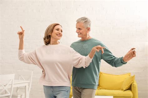 Happy Senior Couple Dancing At Home Stock Photo Image Of Grandparents