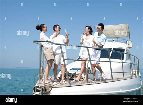 Friends Drinking Champagne On A Yacht Stock Photo Alamy