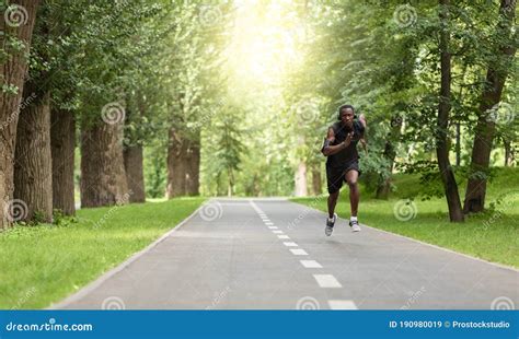 Black Man Jogger Training At Park Getting Ready For Marathon Stock