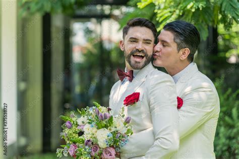 Zdjęcie Stock Newlywed Gay Couple Hugging And Kissing On Wedding