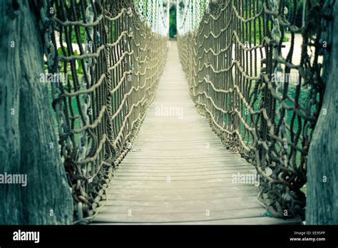 Scenic Wooden Rope Bridge On Sentosa Island In Singapore With Selective
