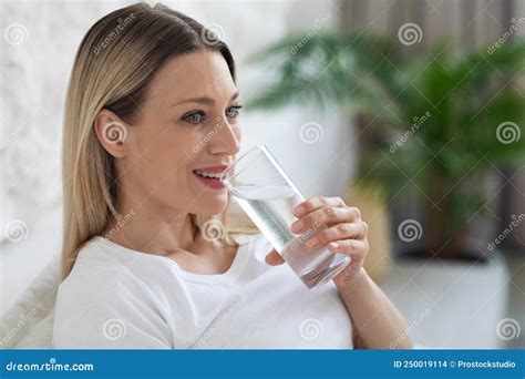 Healthy Young Lady Drinking Fresh Water After Waking Up Stock Photo