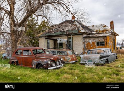 abandoned cars around an abandoned house in the ghost town of ardmore south dakota usa [no