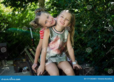 Guy Hugging Girlfriend On Date Showing Something In Air Babe Couple In Love Stock Image