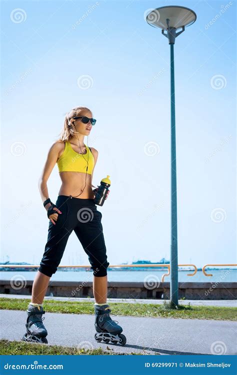 Young Beautiful Sporty And Fit Girl Rollerblading Stock Image Image