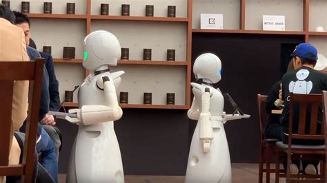 Robot Waiters Remotely Controlled By Differently Abled People Serve At