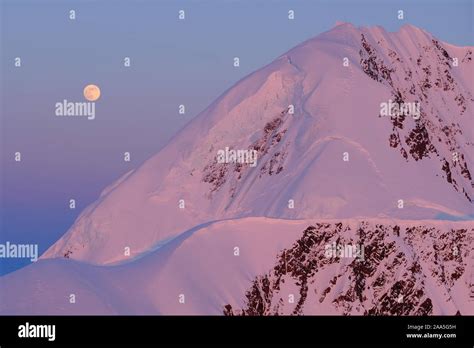 Aerial Photo Of The Chugach Mountains And The Full Moon At Sunset