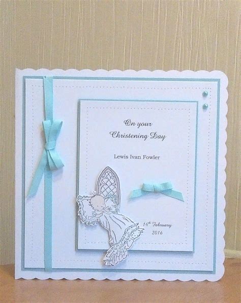 A Greeting Card With A Blue Ribbon And Angel On The Front Attached To
