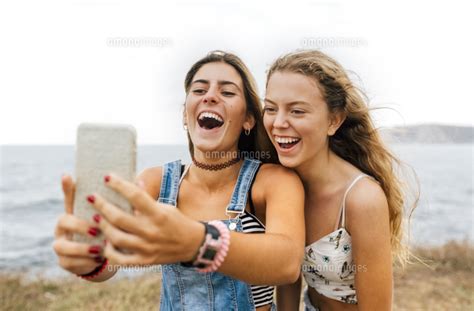 Two Best Friends Taking Selfie With Smartphone At The Coast 11094022951