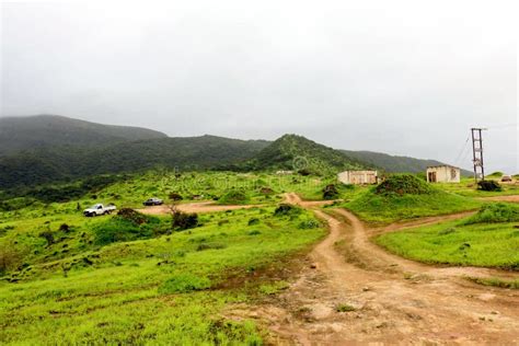 Lush Green Landscape Trees And Foggy Mountains In Ayn Khor Tourist
