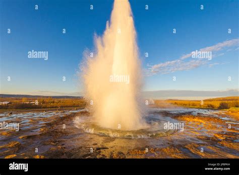 Iceland Iconic Geyser Steam Jet Erupting From The Ground Hi Res Stock