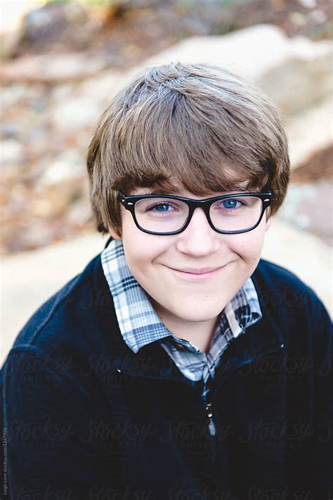 Brown Haired Teen Boy With Glasses Poses For Portrait By Stocksy