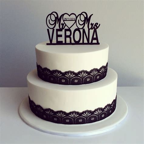 Simple white wedding cake with black lace and personalised  